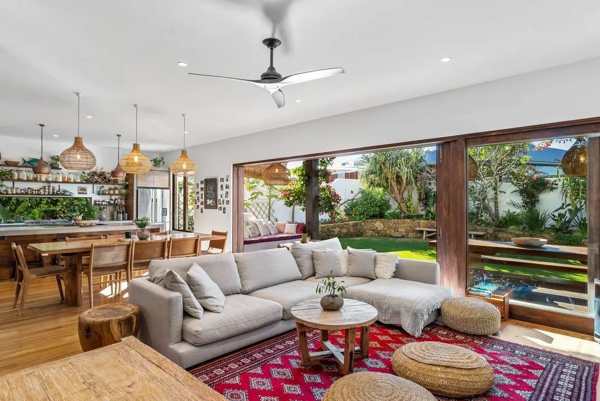Open living room with timber floors and wide garden doors