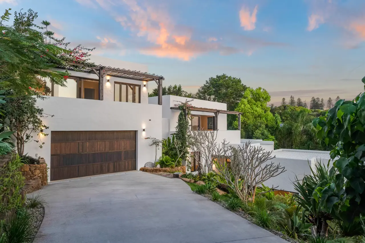 Front of the house with a timber garage door and driveway
